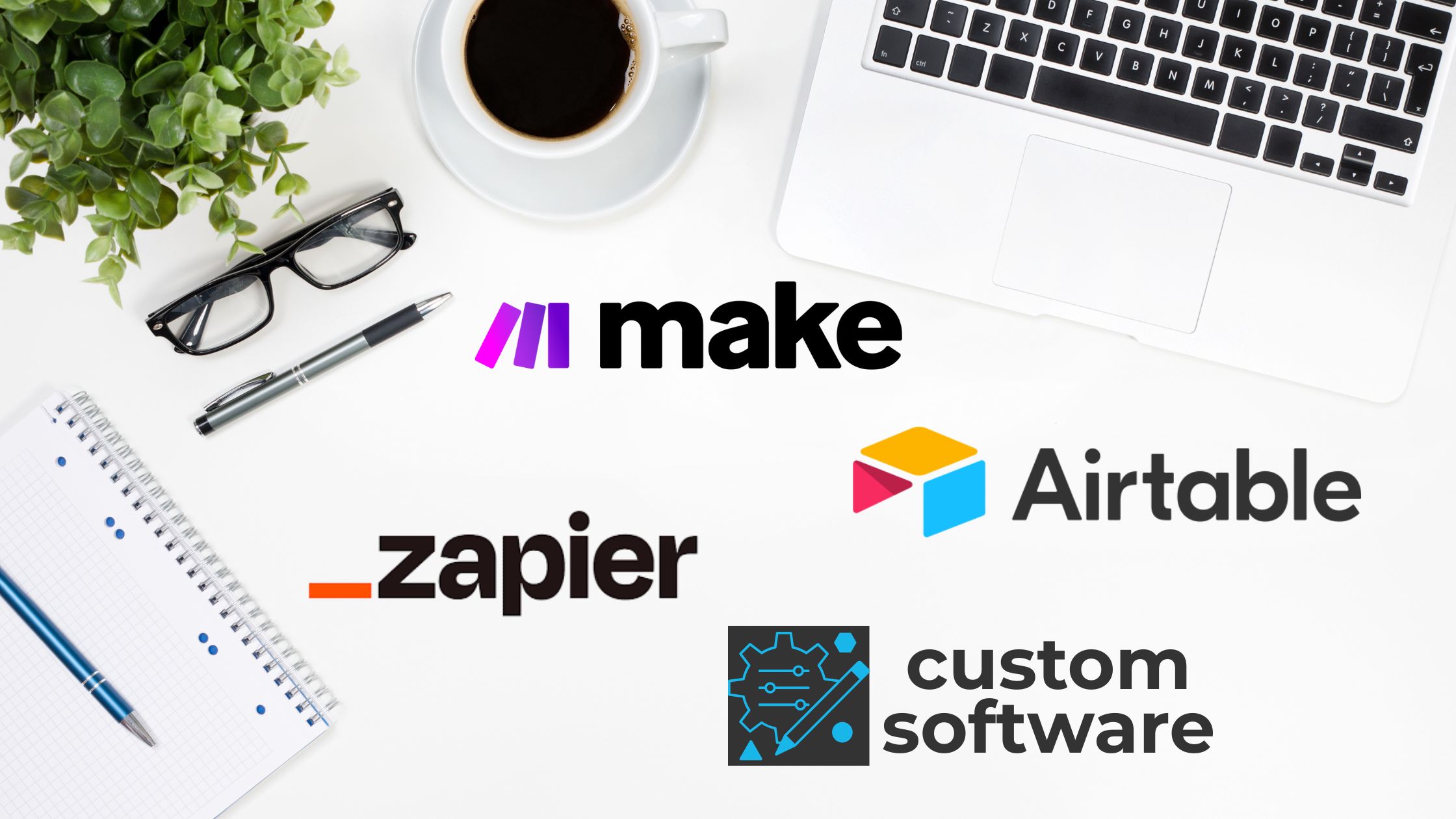 Workspace flat lay with laptop, coffee, and notebook featuring the logos for Make, Airtable, Zapier, and “custom software.”